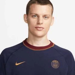 Nike Men's Paris Saint-Germain Travel Short Sleeve Soccer Top - Blackened Blue/Team Red/Gold Suede -Sportswear Sales Store download 22 4c36b34d 2a70 4a19 b17b 163c75ba01ec